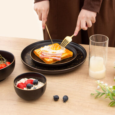 Elegant black and gold ceramic plate bowl set